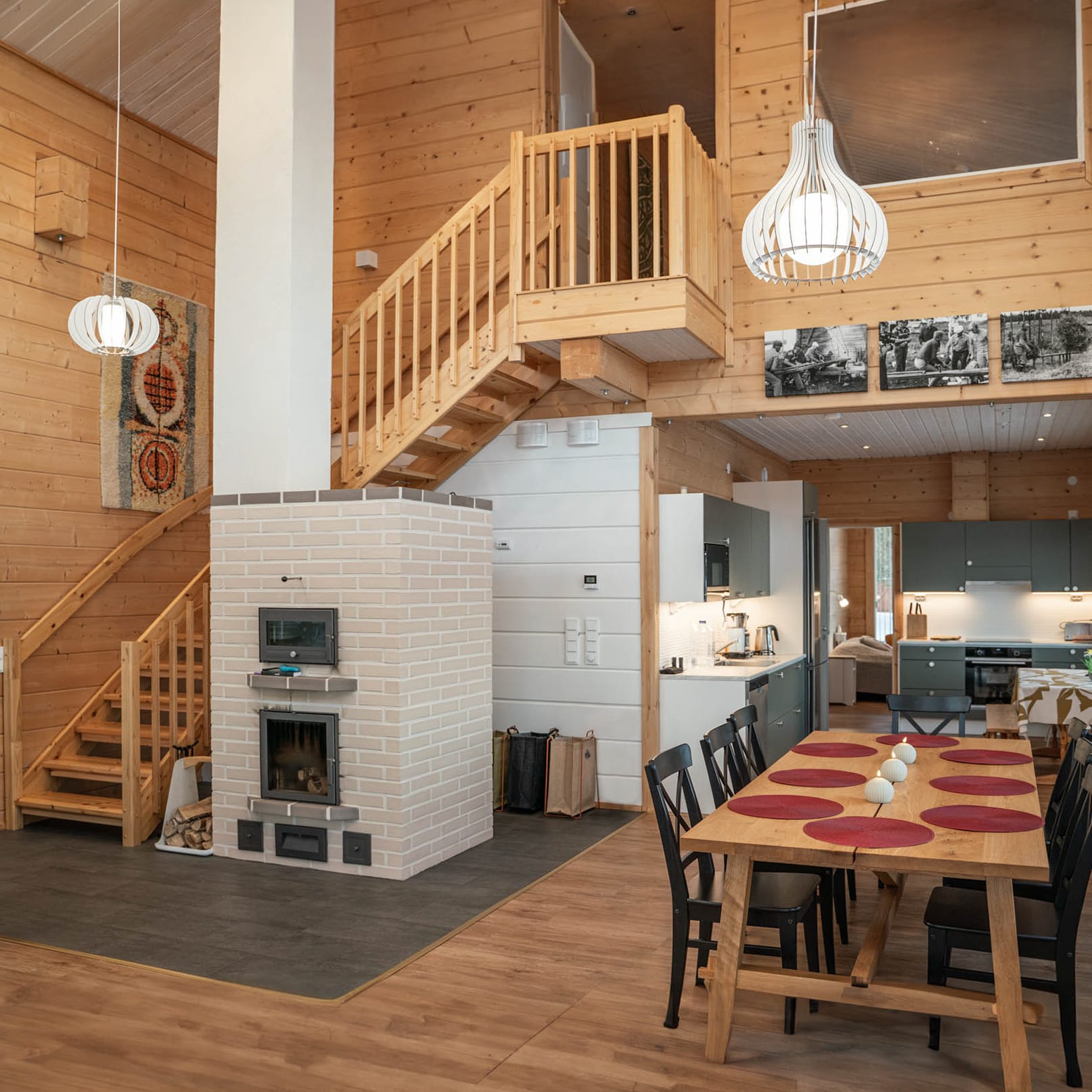 Open-plan living room with a fireplace and stairs up to the loft