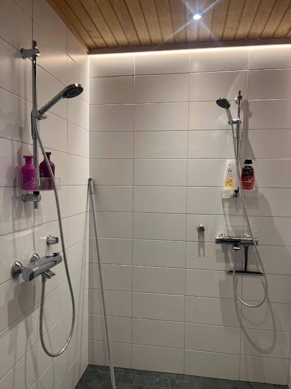 Tiled shower room with two showers